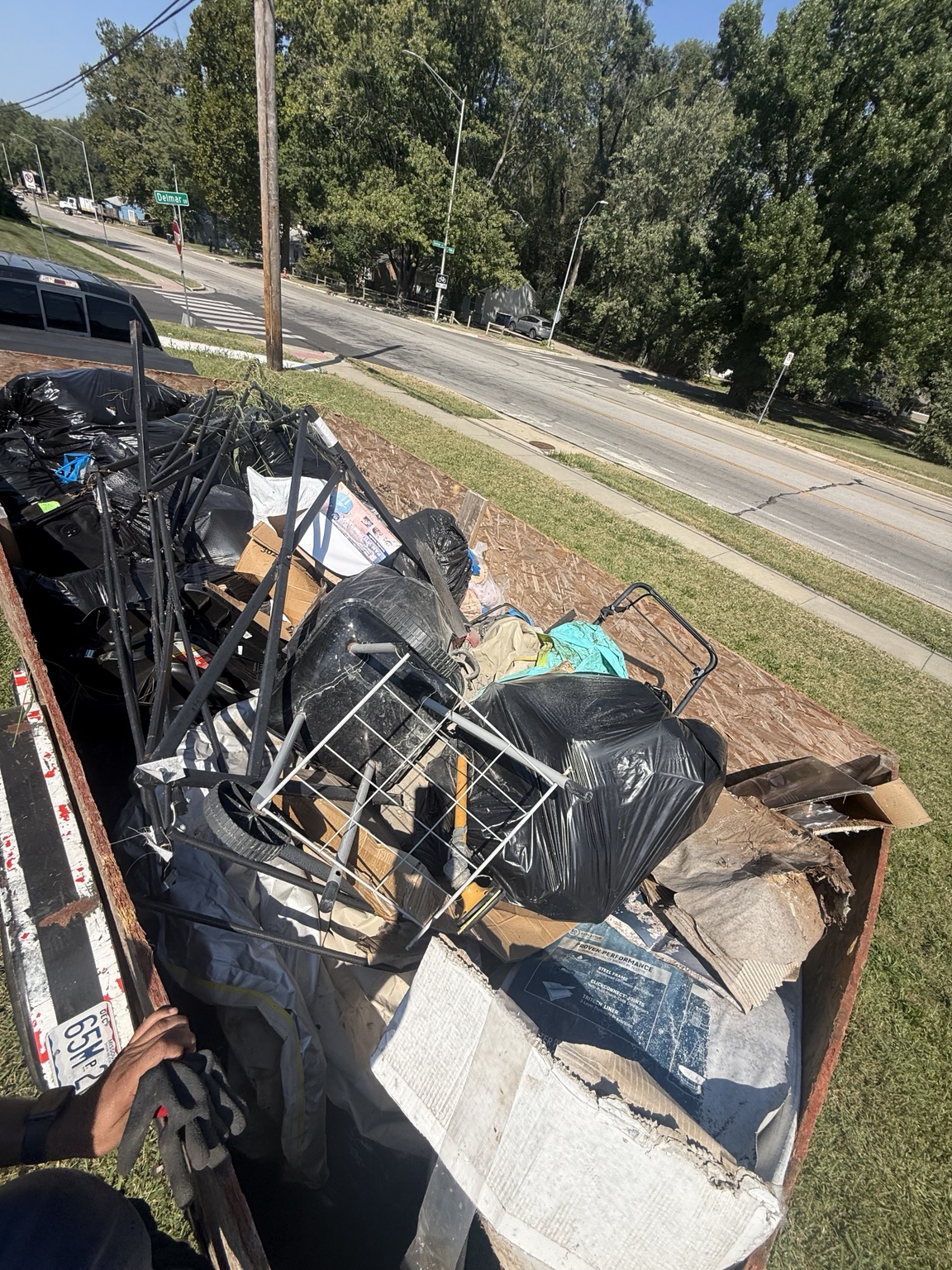 Full junk removal trailer ready for hauling