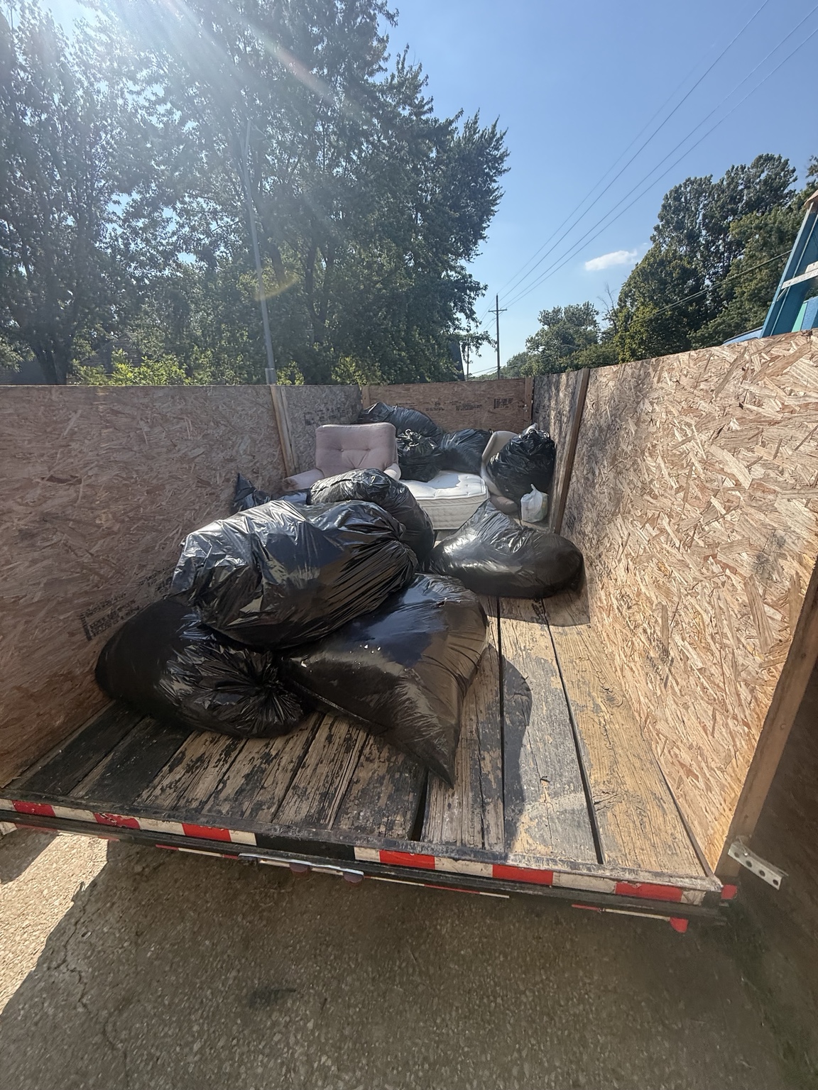 Junk removal trailer with a loaded cleanup job